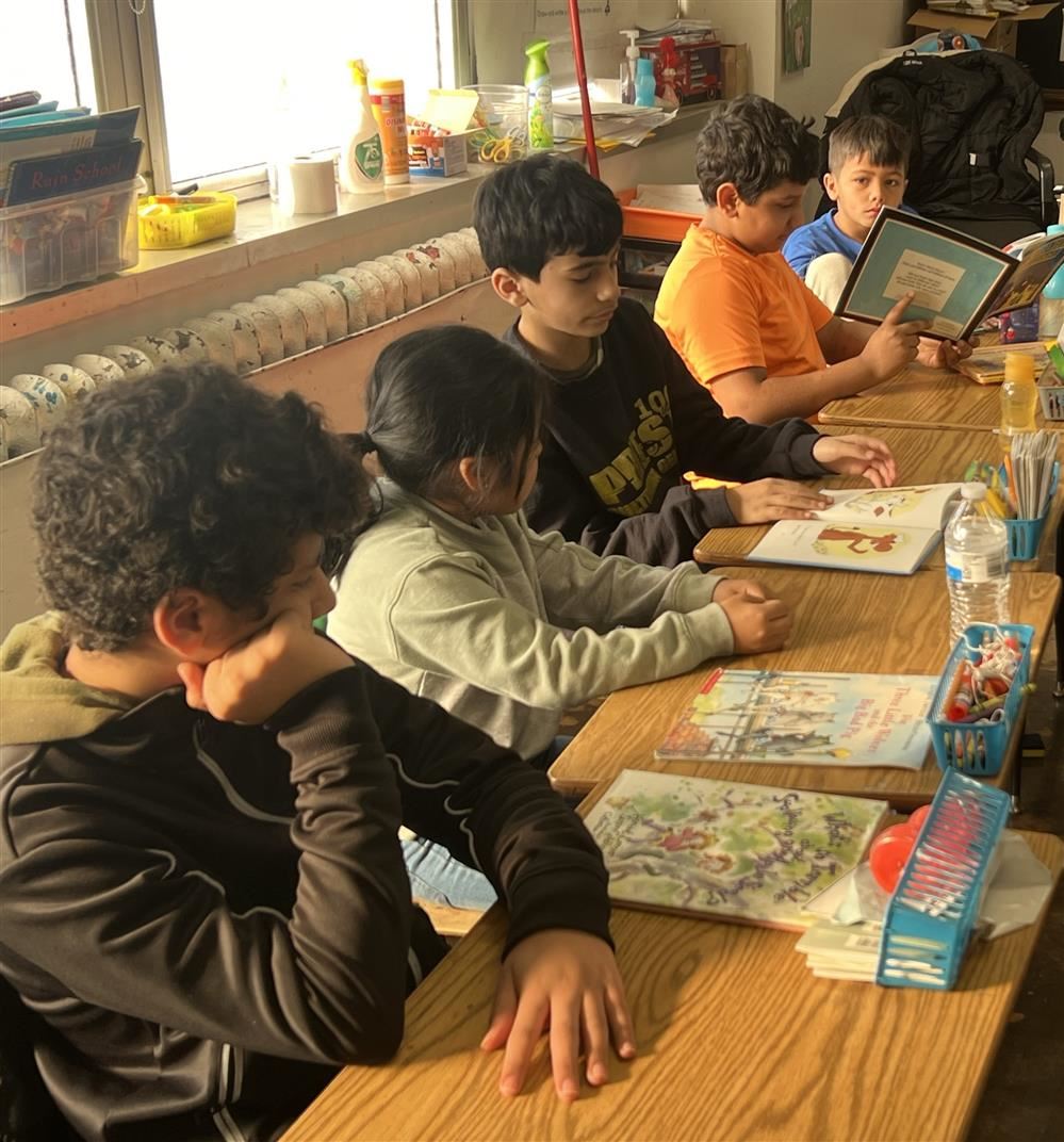 Students read in pairs in a cozy classroom at Priest Students read in pairs in a cozy classroom at Priest